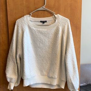 White puffy sweater